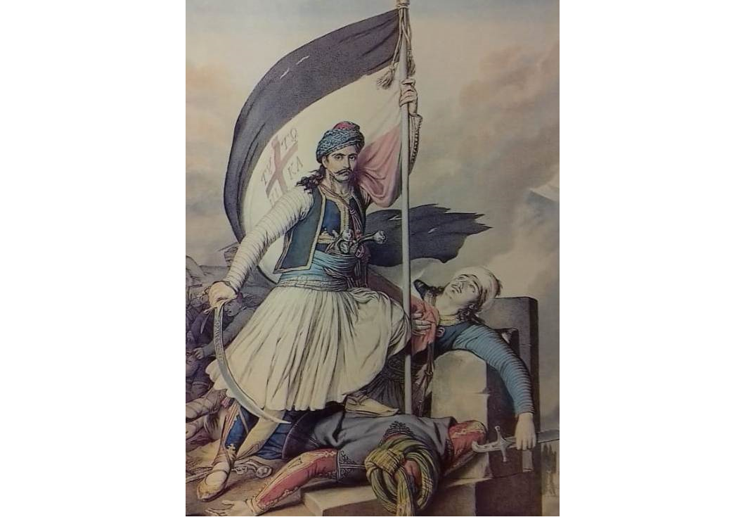 Την τρίχρωμη σημαία σαν του Αλέξανδρου Υψηλάντη κρατάει ο επαναστάτης στην έγχρωμη λιθογραφία του L. Dupré (1825)